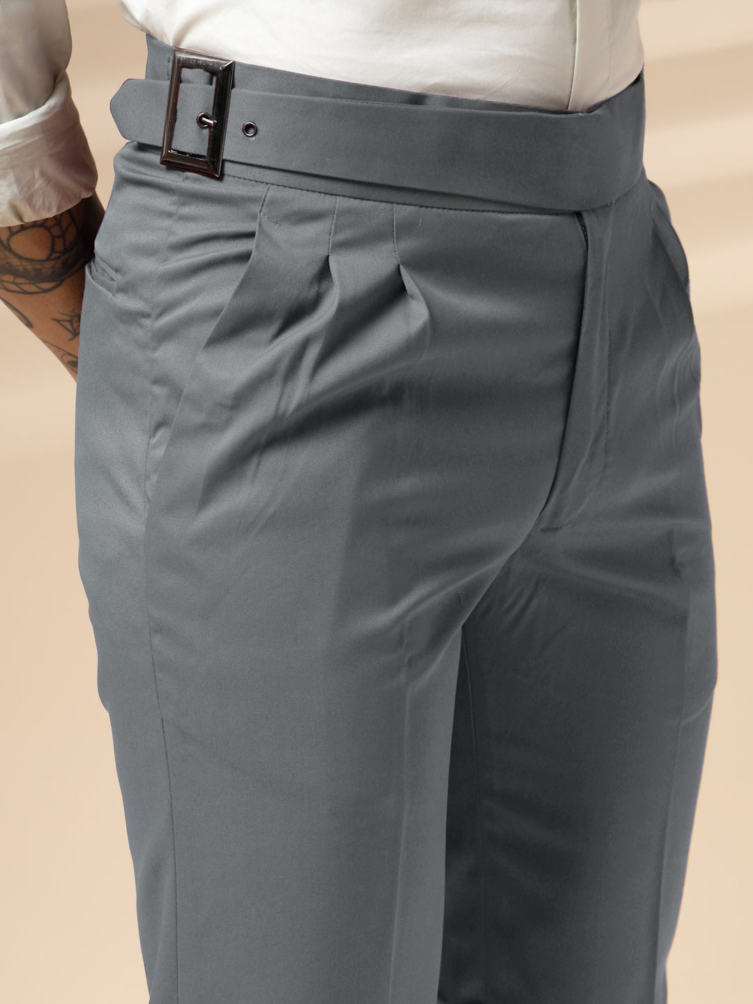 Gray Gurkha Pant with a belt on a beige background